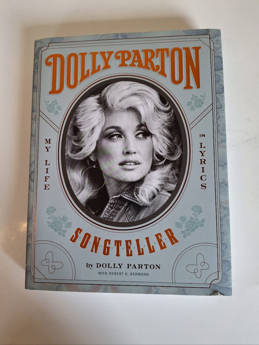 Dolly Parton "Songteller" Hardcover Book - Light Blue & Orange